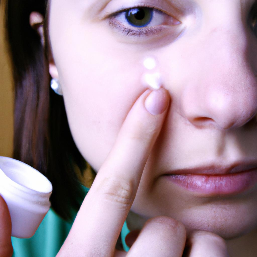 Person applying moisturizer to face